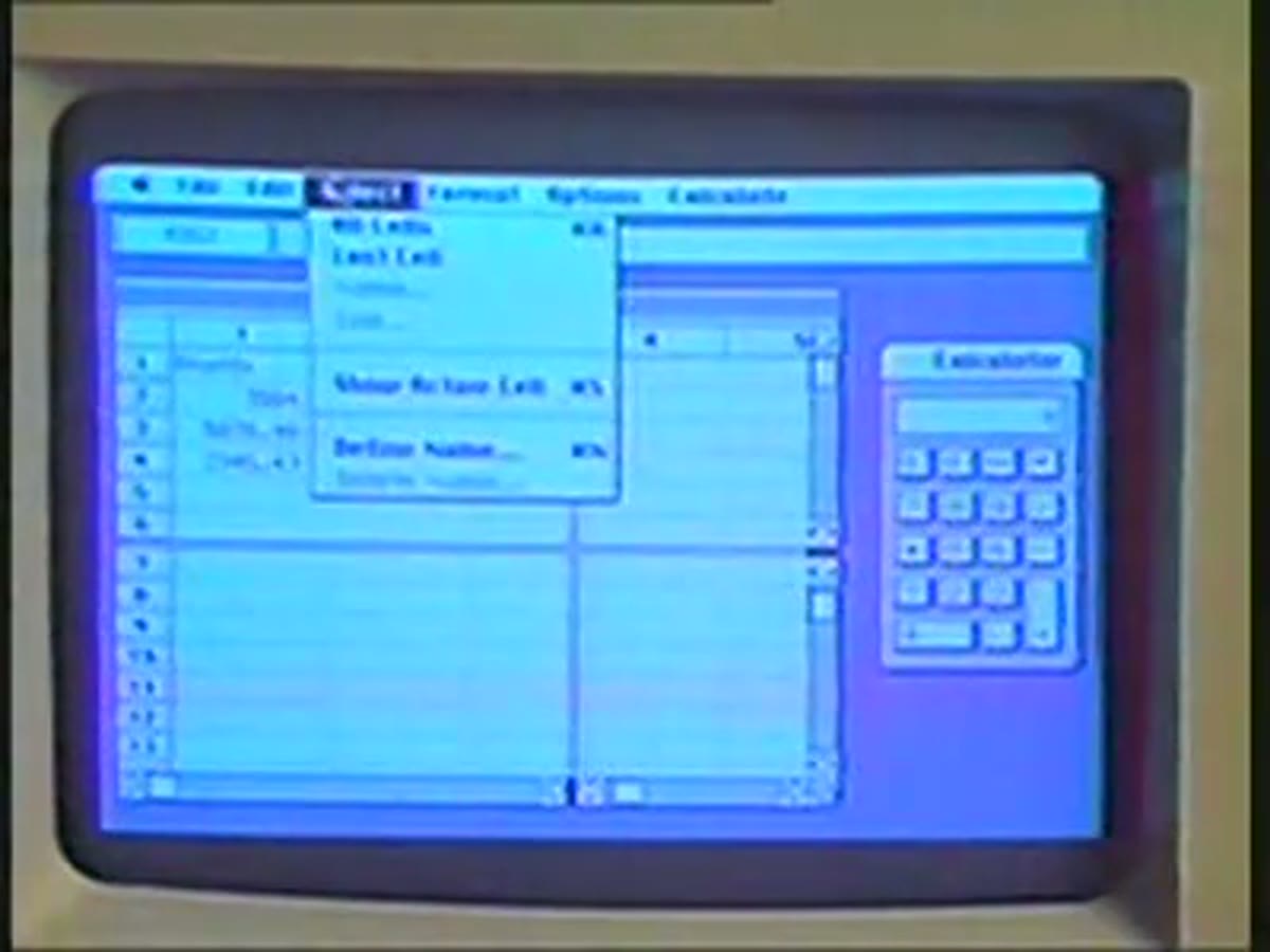 The Macintosh startup screen, showing the word Macintosh mid-animation.