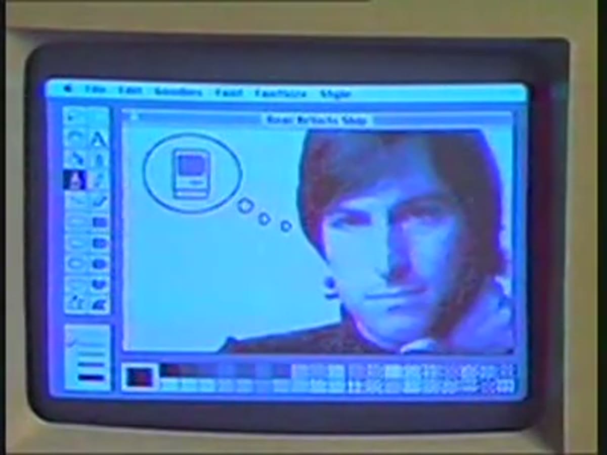 A MacPaint sketch portrait of Steve Jobs displayed on the Macintosh screen.