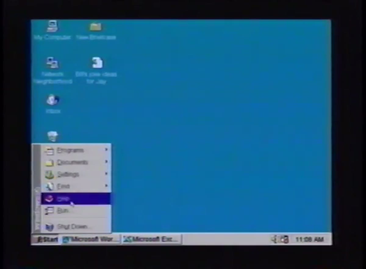 The Windows 95 desktop with the Start menu open, shown on a projector during the launch.