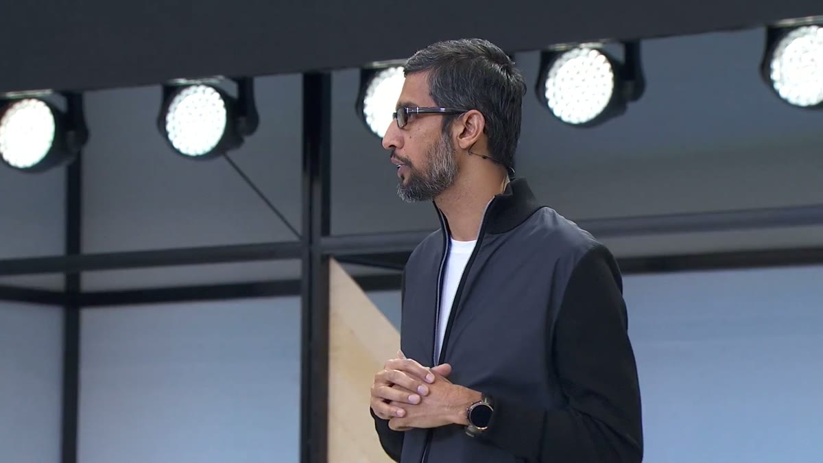 Sundar Pichai standing alone on the keynote stage.
