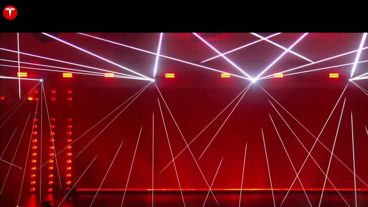 A red laser grid pattern projected on the stage before the truck's reveal.